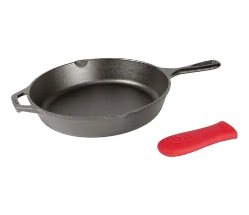Lodge 12 inch cast iron skillet with red silicone handle holder and steak