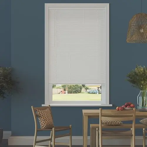 Lumino vinyl mini blinds in a white finish on a kitchen window