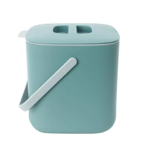 Blue Ginkgo green plastic compost bin with handle on countertop