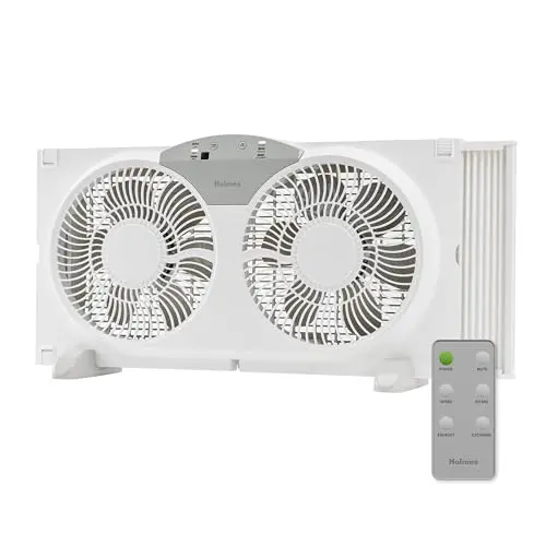 HOLMES 9-inch twin digital window fan with remote control installed in kitchen window